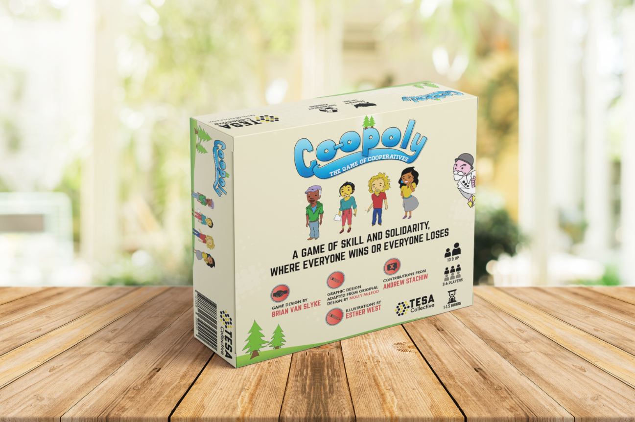 Coopoly board game box on a wooden table with a blurred outdoor background