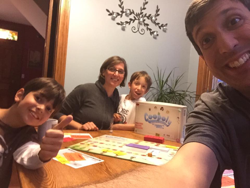 Family playing board games together at a table